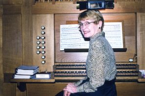 Katrine Aho sitting at organ in Memphis ca. 2000
